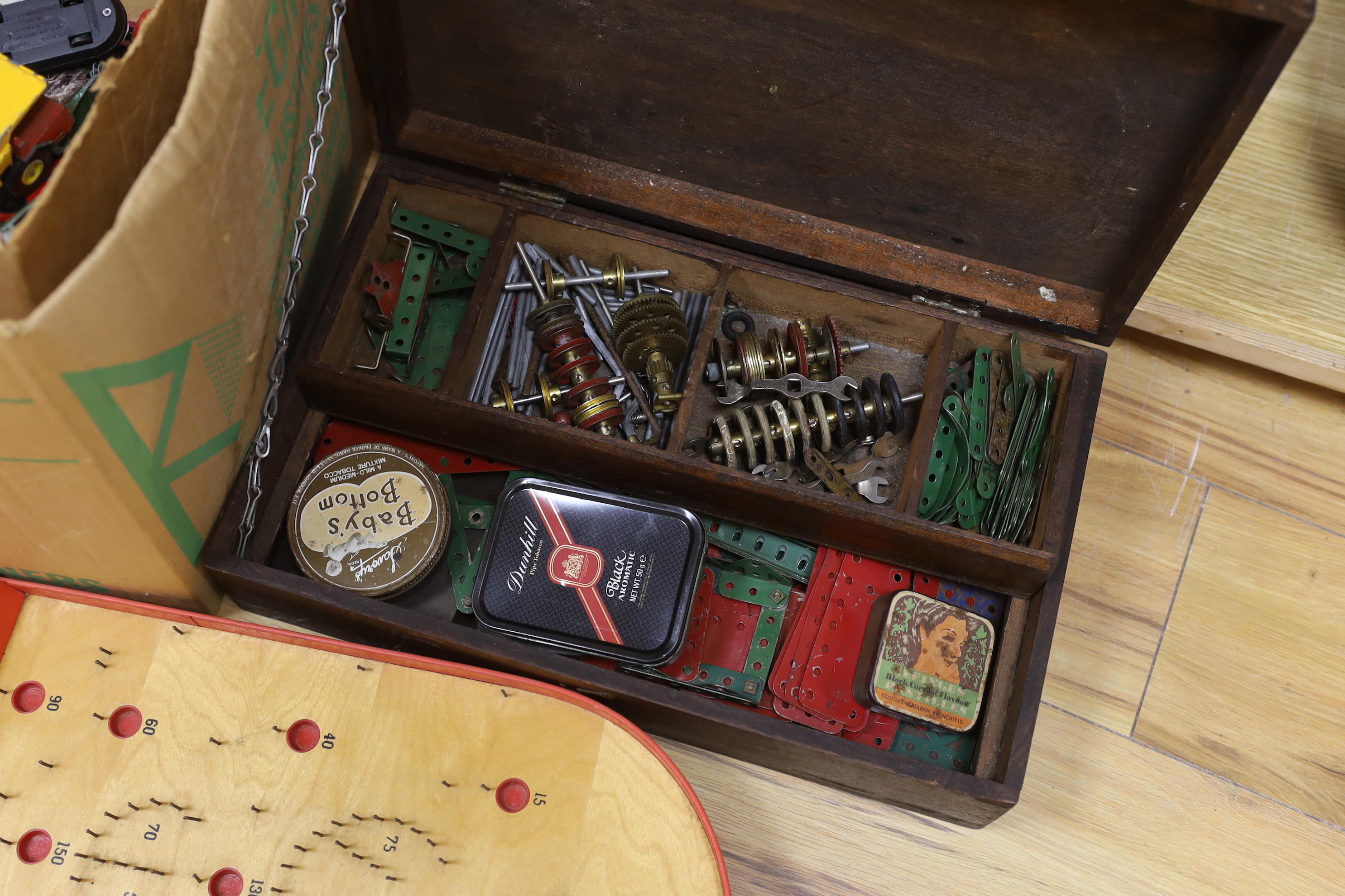 A quantity of Meccano, Dinky toys and a bagatelle board